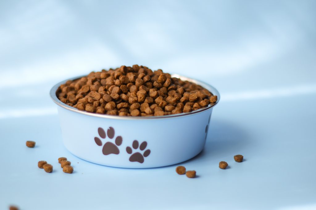 Over the past few years, there has been a lot of awareness and controversy surrounding dog food. Pet owners are paying greater attention now, more than ever, to the ingredients in their dog’s food which has led to a huge market of premium pet foods and products. The good news is that pet food is highly regulated by the FDA and has undergone rigorous testing by veterinary specialists. Here are a few key points to hit on when discussing which dog foods are better and healthier: Dogs are not strict carnivores. Although meat does make up the majority of a dog’s diet, dogs can derive nutrients from grains, fruits, and vegetables. Even if an owner is a vegan or a vegetarian their pets will not be. Dogs were raised to eat the insides of the animals that they catch/hunt. When a deer is brought down the wolf will eat the stomach contents as well as the meat on the haunches and such. The best dog foods will contain a combination of meat, vegetables, grains, and fruits that are high-quality. There may be grain free diets out that are readily available but I, personally, cannot feed that without the recommendation of my vet stating that grains may be harming them and their health. Knowing how to read and interpret dog food labels is key. Products labeled as “dinners” typically contain about 25% of the actual meat content while products labeled as having “flavorings” contain just trace amounts of the actual meat content. I and my pets are still looking for the “perfect” dry food but I still add to their food. I add greek yogurt (as my dogs have horrible gas) LOL, I add fresh and cooked veggies leftover from the making of dinner or lunch. If anyone has a great suggestion for dry food to feed my pets, I will take a look at all of them. I even went so far as to feed a raw diet to my dogs, but alas, that got to be too expensive with 5 or 6 dogs and then the cats sneaking in for a bite or tow. Overall, dogs need a healthy, balanced diet just like humans - unless they are suffering from an allergy. Consult with your veterinarian to determine if your dog is subject to any allergies and to have them recommend the best food to fit your dog’s individual digestive needs.